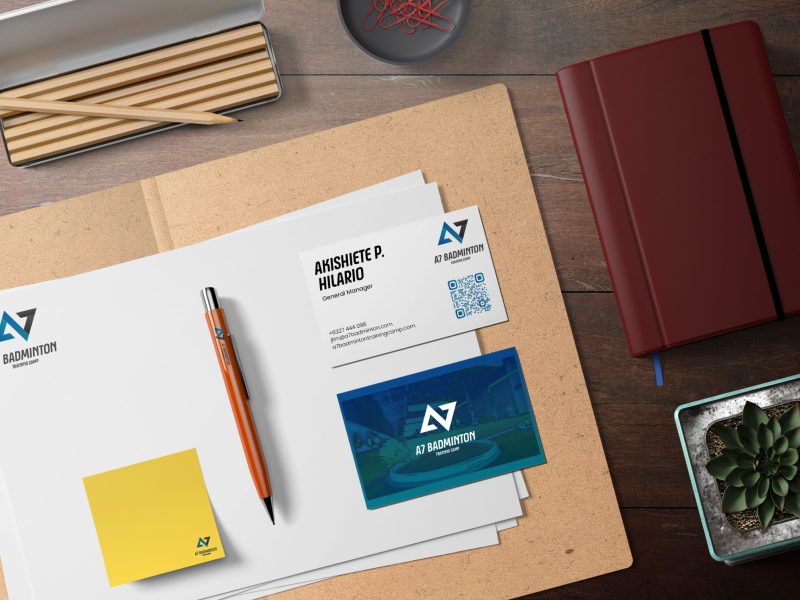 Clean minimal business card mockup floating on top table with leaves background. PSD file.