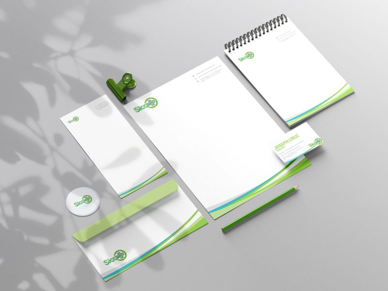 Clean minimal business card mockup floating on top table with leaves background. PSD file.