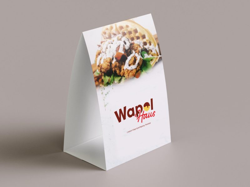 Clean minimal business card mockup floating on top table with leaves background. PSD file.